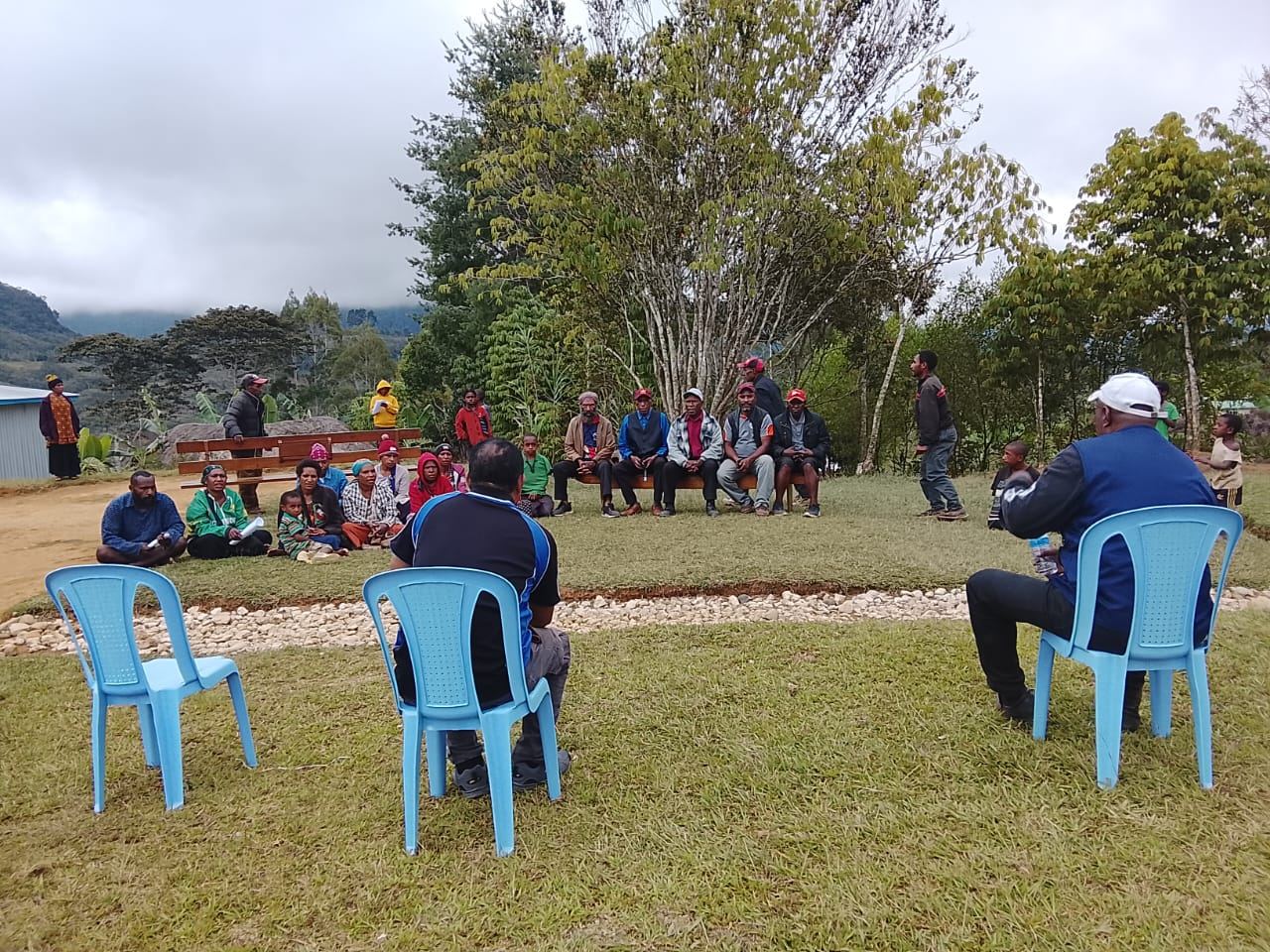 A community gathered in a circle for a Community Curriculum session in the Highlands