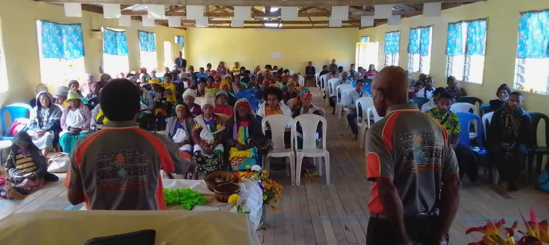 A full community hall during a SARV awareness program in Tari, Hela