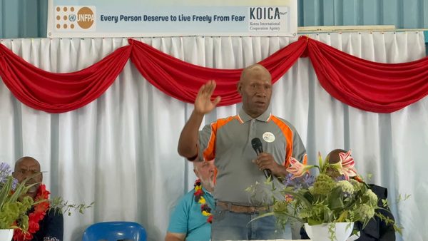 A speaker addresses the graduates. Catholic Diocese of Goroka, YC Hall, Goroka, Eastern Highlands. September 2026.