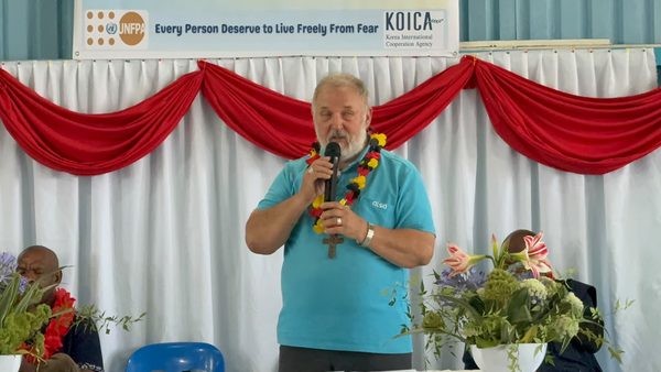 A speaker addresses the graduates. Catholic Diocese of Goroka, YC Hall, Goroka, Eastern Highlands. September 2026.