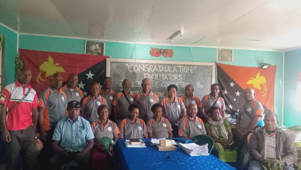 Weekly facilitators meeting during community rollout. Maunkui (SDA), Maku, Simbu. July 2026.