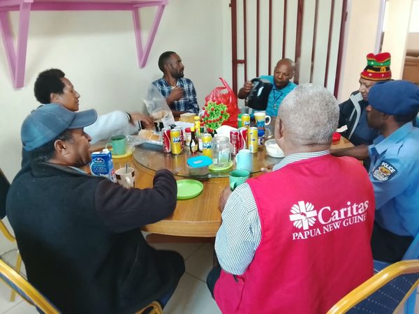Invited guests gather before the graduation ceremony. Catholic Diocese of Mendi, Lower Mendi Parish Centre, Tepe, Southern Highlands. September 2026.